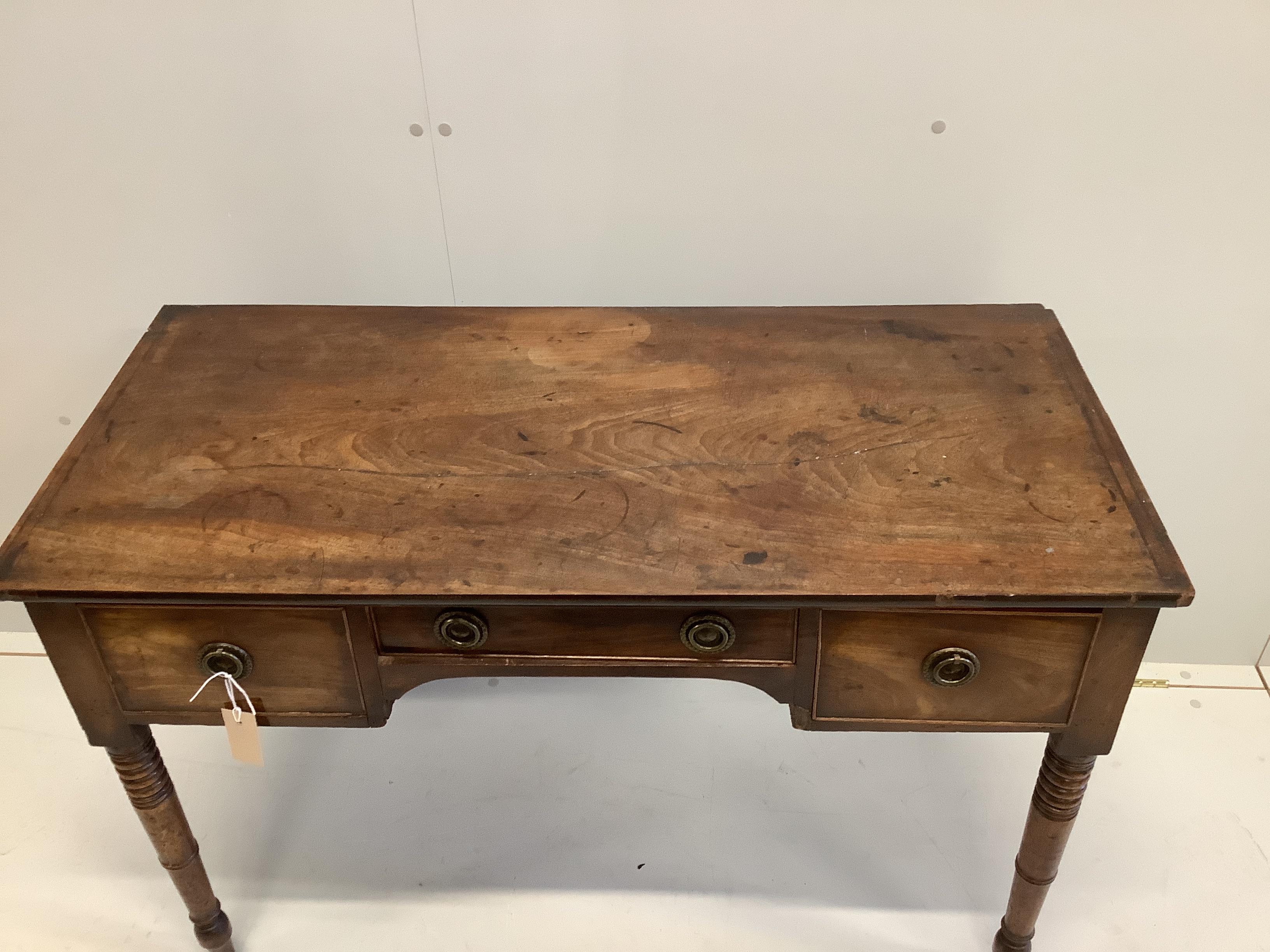 A Regency mahogany kneehole dressing table, width 106cm, depth 49cm, height 71cm